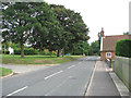View south-east along The Street in NR14 7UG
