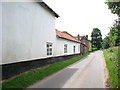 View south along Aslacton Road in NR16 1JJ
