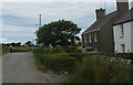 Houses at the road junction near Llanfwrog Church in LL65 4YF