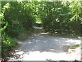Bridleway crosses Grove Road in Perry Wood in ME13 9RP