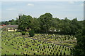 Hazel Grove churchyard, from the railway in SK7 6AA