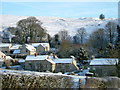 Our house (pictured central with brown windows) in Carsington village in Carsington