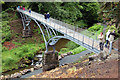 Visitors on the Iron Bridge, Cragside in NE65 7PX