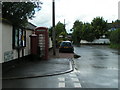 Village notice board, post box and telephone in EX5 5DP