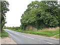 The Turnpike (B1113) past dismantled railway bridge in NR16 1ES