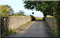 Bridge over disused railway near Lairhillock mobile home park in CV23 9TP