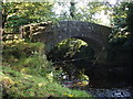 Bridge over brook, tributary of the River Derwent, near Chatsworth in DE45 1SS