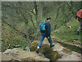 Striding across Lumb Spout in Trawden Forest