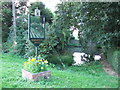 Village sign and pond, Wisbech St Mary in PE13 4AS