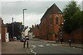 Main Street Abbots Bromley beneath gathering rain clouds in WS15 3DL
