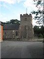 Looking from the village hall across to the parish church at Diddlebury in SY7 9LA
