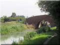 Aylesbury Arm: A narrowboat passes under Canal Bridge No 13 in HP22 7DE