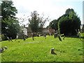 A verdant churchyard at St Mary, Adderbury in OX17 3NF