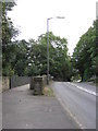 Unstone - View of (B6057) road and footbridge in S18 4DU