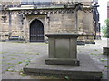 The tomb of Eliugh Yale and west door of St Giles' in LL13 8BA