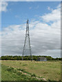 Pylon and barn beside New River in CB25 0BH