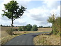 Country Road And Footpath in CO10 8BZ