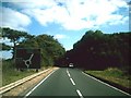 Approaching Asthall Barrow roundabout in OX18 4HJ