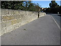 Looking north east on Ayton bridge, and a bench mark in YO13 9JJ