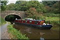 Narrow Boat emerging from bridge on Leeds Liverpool Canal in PR7 4FD