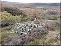 Heap of stones beside Balnaguard Burn in PH9 0PY