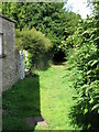 Looking W along footpath from The Street in SN14 6EL