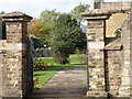St Andrew's Church gates and Bench Mark in PE7 1DE