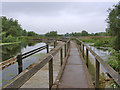 Footbridge over the River Soar weir, Watermead Country Park in LE4 4EH