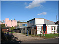 Industrial units by Station Road (B1134) in Sneath Common