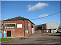 Industrial buildings north of Station Road (B1134) in Sneath Common