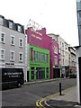 Brightly coloured buildings on Tontine Street in CT19 6NG