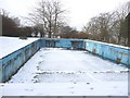 Snow covers the empty swimming pool in BS40 7RE