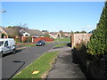Looking back along Spring Vale towards Rosemary Way in PO8 9HY
