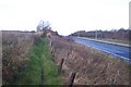 Footpath beside the A2 dual carriageway in ME13 9LG