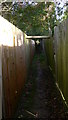 Narrow footpath at Alfold Crossways in GU6 8JE