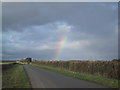 Rainbow over the road out of Meysey Hampton in GL7 5LJ