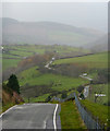 Looking down the mountain road in SY20 8SG