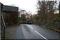 The Ambleside-Hawkshead-Coniston bus enters Outgate in LA22 0NJ