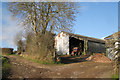 Barns and a track, Hestow Barton in TQ13 0AZ