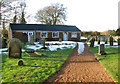 Path traversing churchyard in Narborough