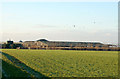 Looking west towards farm buildings at Berry Fields in NN11 8NP