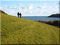 Walkers on the coastal path by the Helford River in TR12 6JL