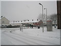 Approaching the junction of  a snowy Hazleholt Drive and Barncroft Way in PO9 3AA