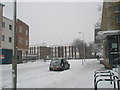 Approaching the junction of  a snowy Park Parade and  Dunsbury  Way in PO9 4RB