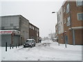 Looking from a snowy Park Parade into Tidworth Road in PO9 4RB