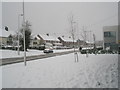 Mid section of a snowy Stockheath Road in PO9 4RB