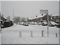 Junction of Timsbury Crescent and a snowy Woodgreen Avenue in PO9 3AA