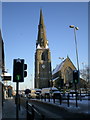 Snowy church and blue sky in OL10 1PD