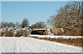 Disused railway bridge in the snow east of Marton in CV23 8EH