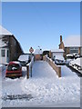 A snowy path from Littlepark Avenue up to Chestnut Avenue in PO7 8AA